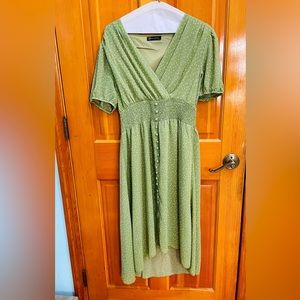 This dress is a high low dress in sage green. Its a great dress for a brunch!